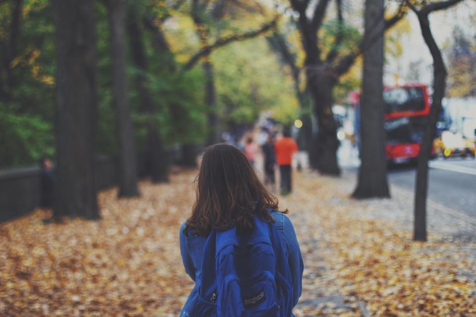 girl, woman, walking, pedestrian, city, urban, lifestyle, sidewalk, leaves, fall, autumn